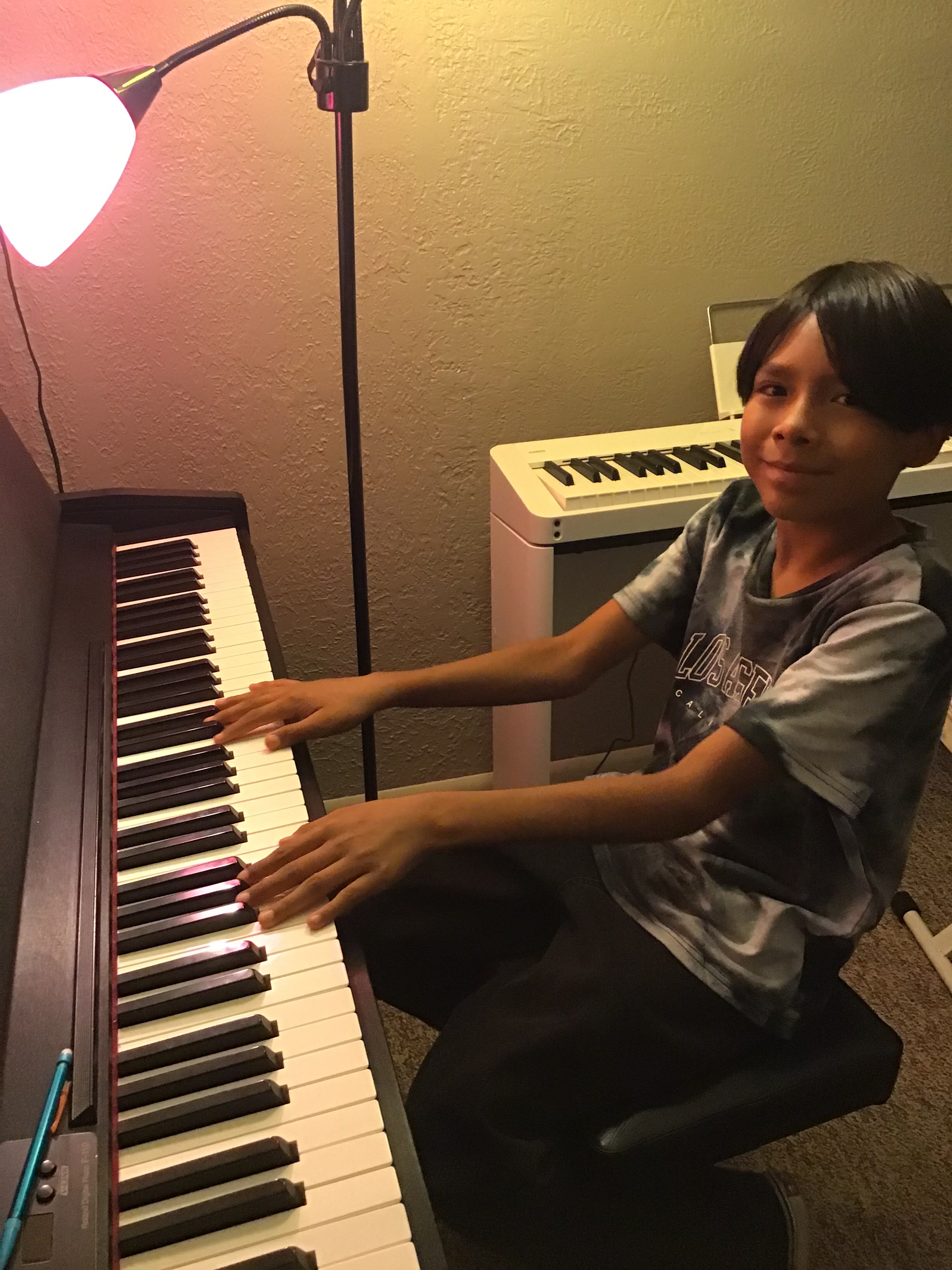 Piano student practicing in studio at Music on the Westside